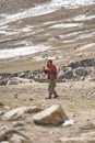 The old woman of the village blesses the men who return to Shimshal after bringing in Upper Shimshal oil reserves and other things