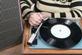 Old woman vinyl record player includes Royalty Free Stock Photo