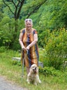 Old woman walking in summer park Royalty Free Stock Photo