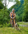 Old woman walking in summer park Royalty Free Stock Photo