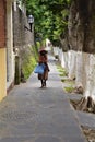 old woman walking at the tree road Royalty Free Stock Photo