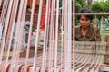 Old woman weave clothes at Annual Lumpini Cultural Festival