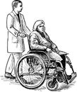 An old woman in a wheelchair with her nurse Royalty Free Stock Photo