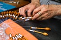 Old woman working on bobbin lace