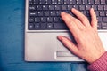 Old woman working on laptop computer at home Royalty Free Stock Photo