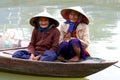 Old womans in a boat on a street in Hoi An, Vietna Royalty Free Stock Photo