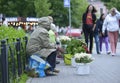 Old women flower sellers sell flowers on the street of the city