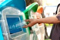 Old women hand throwing away the garbage to the bin/trash, sorting waste/garbage before drop to the bin Royalty Free Stock Photo