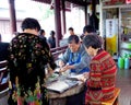 Old women making ravioli