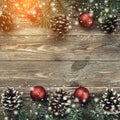 Old wood background with fir branches adorned with baubles and cones. Space for text. Christmas card. Top view. Xmas. Royalty Free Stock Photo