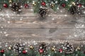 Old wood background with fir branches adorned with baubles and cones. Space for text. Christmas card. Top view. Xmas. Snow effect Royalty Free Stock Photo