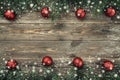 Old wood background with fir branches adorned with baubles. Space for text. Christmas card. Top view. Xmas. Snow effect Royalty Free Stock Photo