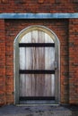 Old wood barn door and brick wall