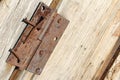 Old wood barn door with rusty nails and hinge Royalty Free Stock Photo