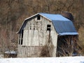 Old sagging wood barn gambrel roof in Fingerlakes NYS
