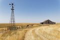 Wood barns, stables and windmill in North dakota countryside