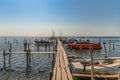 Old wood boats pier. Little wooden platform for boat and speedboat at sea marina