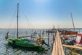 Old wood boats pier. Little wooden platform for boat and speedboat at sea marina