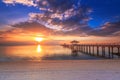 Old wood bridge pier  against beautiful sunset sky use for natural background ,backdrop and multipurpose sea scene Royalty Free Stock Photo