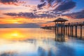 Old wood bridge pier  against beautiful sunset sky use for natural background ,backdrop and multipurpose sea scene Royalty Free Stock Photo