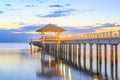 Old wood bridge pier  against beautiful sunset sky use for natural background ,backdrop and multipurpose sea scene Royalty Free Stock Photo