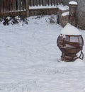 An old wood burner in the snow Royalty Free Stock Photo