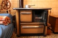 Old wood-burning stove in the kitchen of ancient home Royalty Free Stock Photo