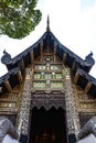 Old wood carving temple, decorative by glass mosaic, Thailand