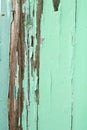Old wood with chipped peeling teal paint
