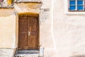 Old wood door on colorful medieval streets of Sighisoara