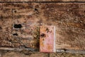 Old wood door with cracks, rust and loose pieces dirty texture Royalty Free Stock Photo