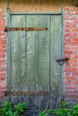 Old wood slat door painted green Royalty Free Stock Photo