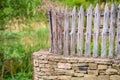 Old wood fence with a green countryside Royalty Free Stock Photo