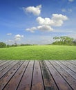 Old Wood floor over green field and sky Royalty Free Stock Photo