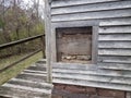 Old wood house with window and stones