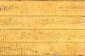 Old wood painted board yellow fence texture Royalty Free Stock Photo