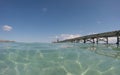 Old wood pier in Alcudia beach in the Spanish island of Mallorca