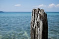 Old wood post with sea background Royalty Free Stock Photo