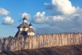 Old wood rustic church building and wooden fence against blue sk Royalty Free Stock Photo