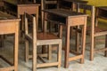 Old wood school classroom furniture. Set of table and chair for school kids nobody used weathered