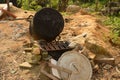 old wood stove with fallen pot Royalty Free Stock Photo