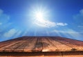 Old wood table and sun shine on blue sky