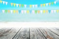 Old wood table top on blurred beach background with coconut leaf Royalty Free Stock Photo