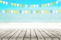 Old wood table top on blurred beach background with coconut leaf Royalty Free Stock Photo