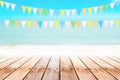 Old wood table top on blurred beach background with coconut leaf Royalty Free Stock Photo