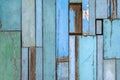 Old wood up into the wall. Vintage wood background with blue color peeling paint Royalty Free Stock Photo