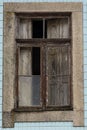 Old wood window half open. Blue portuguese tiles