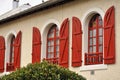 Old wood windows on a concrete house Royalty Free Stock Photo