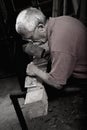 Woodcarver working with mallet and chiesel Royalty Free Stock Photo