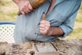 Old woodcarver working with mallet and chiesel Royalty Free Stock Photo